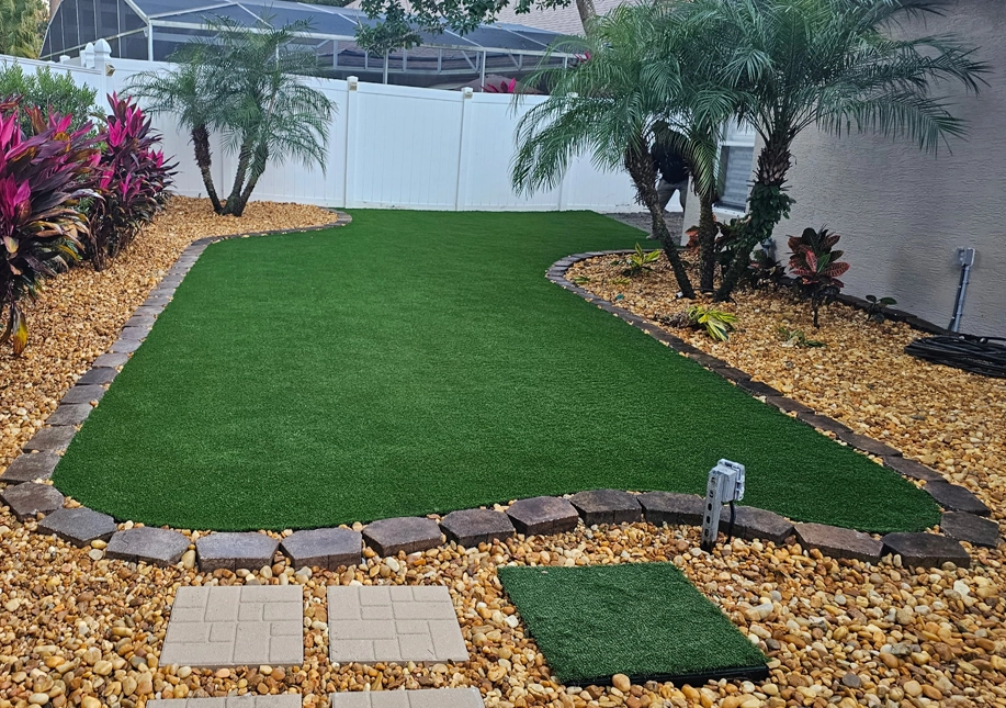 Professional site preparation showing the compacted base system required for a successful and level artificial turf installation.