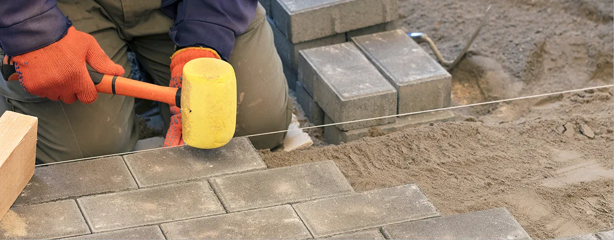 Custom-designed paver patio with intricate stone patterns, enhancing outdoor living space in Orlando.