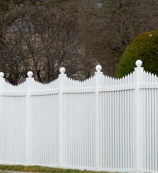 Close-up of secure fence post anchoring and precise panel alignment during a professional installation.