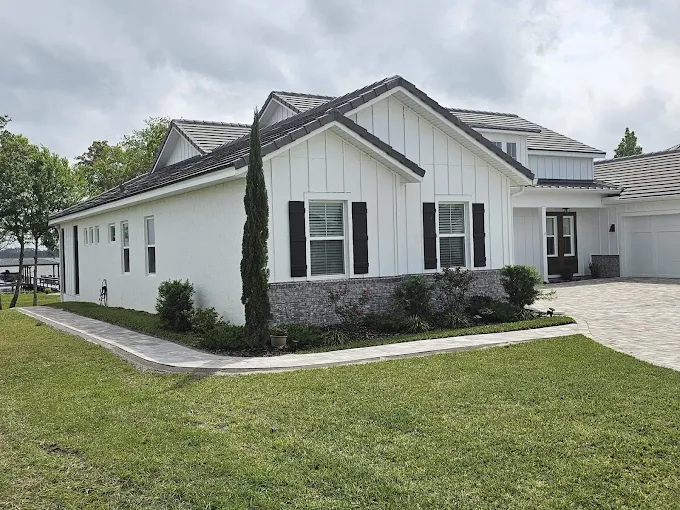 Freshly installed green sod lawn in front of a suburban home