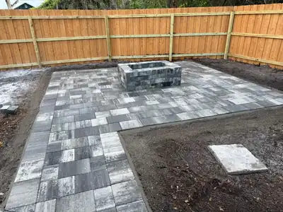 Custom stone paver firepit installation creating a functional outdoor living space in Apopka.