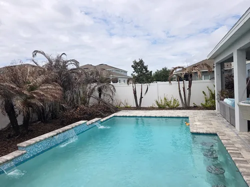 Daytona Beach pool area before the landscaping demo and new plant design