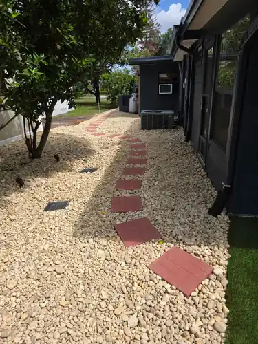 Paver walkway running through the Sanford backyard turf