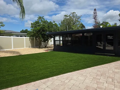 Sanford backyard with artificial turf and surrounding landscaping